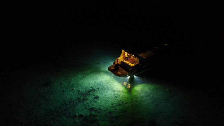 Boat moored at night — ALK Lighting underwater boat lighting
